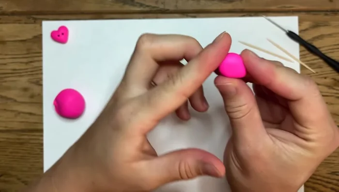 Slope the top of the heart to make it resemble a half-circle.