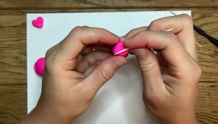 Continue smoothing the edges, pulling your finger along the surface to achieve a smooth finish. The clay is forgiving, so don't be afraid to make adjustments.