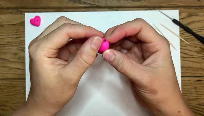 Continue smoothing the edges, pulling your finger along the surface to achieve a smooth finish. The clay is forgiving, so don't be afraid to make adjustments.