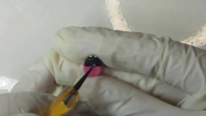 Add legs: Make dots on the back with your smallest dotting tool.