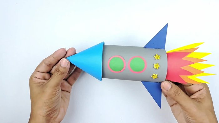 Wrap gray or silver paper around the toilet paper roll and secure with glue.