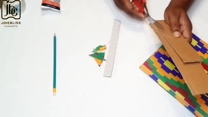 Prepare the stand: Cut two pieces of fabric (7x10 inches and about 2 inches wide). Fold the longer piece and glue it.