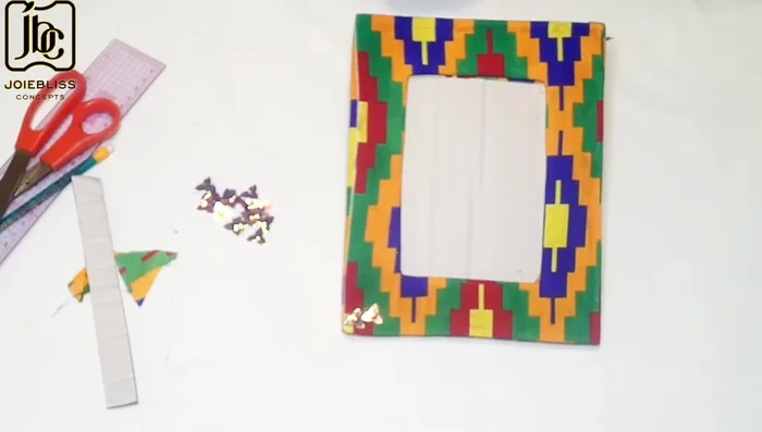 Embellish the frame corners (optional).