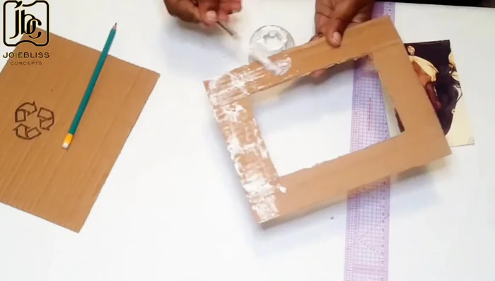 Cover cartons with fabric, trim excess fabric.