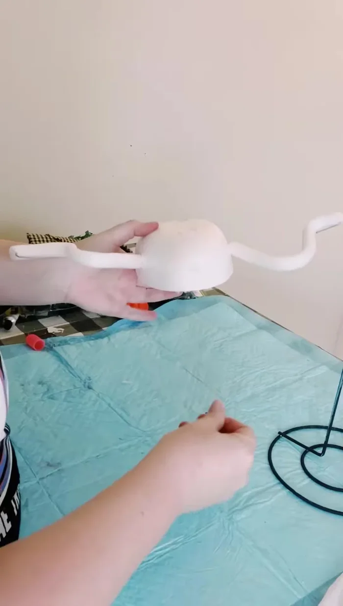 Secure the paper towel holder with hot glue (optional).