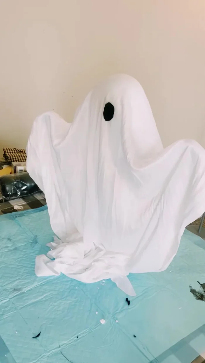 Cut out black felt circles for the eyes and glue them onto the ghost.