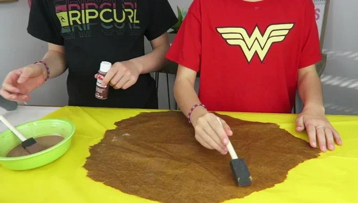 Apply hair conditioner or lotion to soften the paper and prevent crumbling.