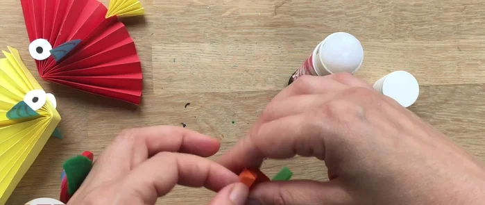 Hang the fish: Attach a small piece of string or tape to the top of the fish for hanging.