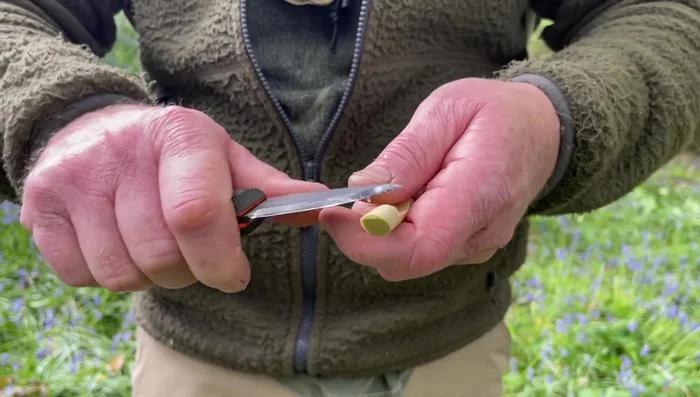 Cut an angled slope at the opposite end to create an air entry point.