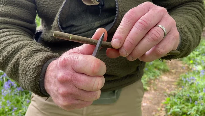 Gently twist and crack the bark off, using a knife tap to loosen if needed.