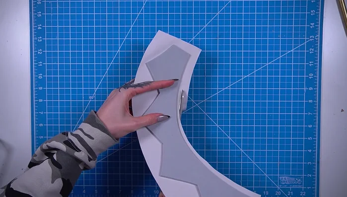 Cut, fold, and glue the edges of the fabric to create a clean finish.