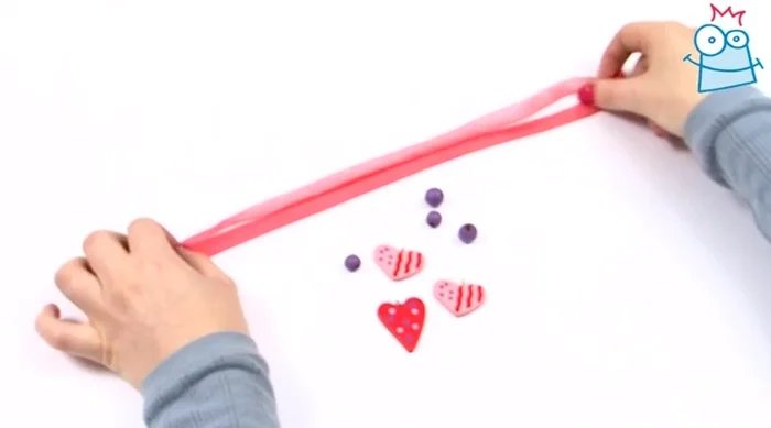 Match up the ends of the ribbon so the heart falls in the middle.