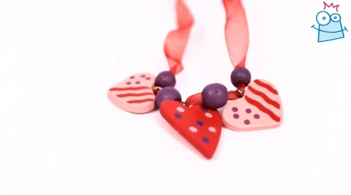 Knot the ends of the ribbon together to complete the necklace.