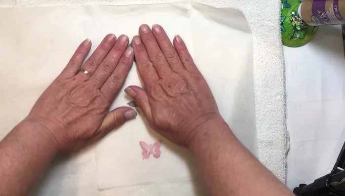 Cut out the desired shape around your pressed element, leaving a border of wax paper.