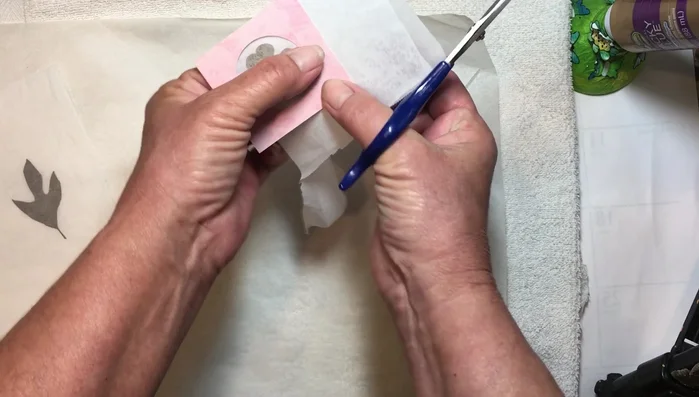 Trim any excess wax paper for a clean finish. Gently press to secure.