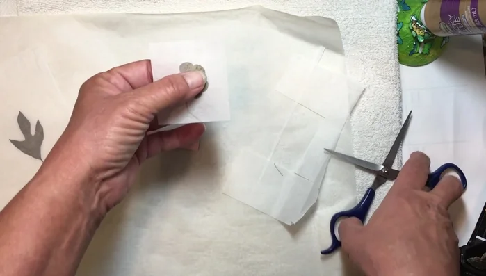 Trim any excess wax paper for a clean finish. Gently press to secure.