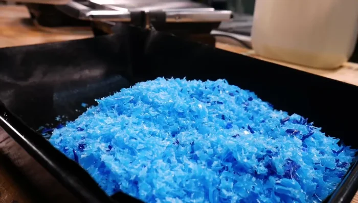 Melt white plastic in panini press: Melt white plastic (Fortissip bottles) in a panini press for a marbled effect.