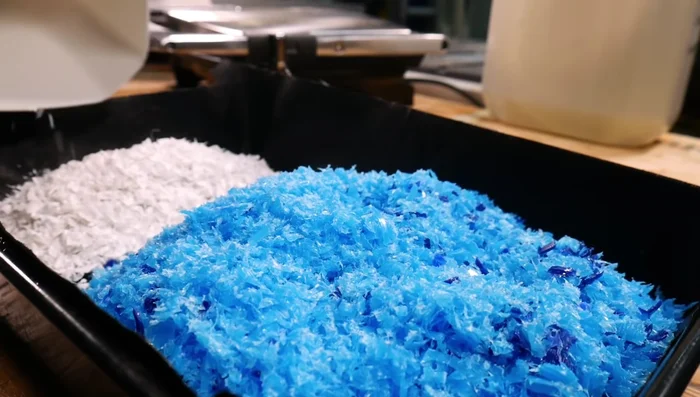 Melt white plastic in panini press: Melt white plastic (Fortissip bottles) in a panini press for a marbled effect.