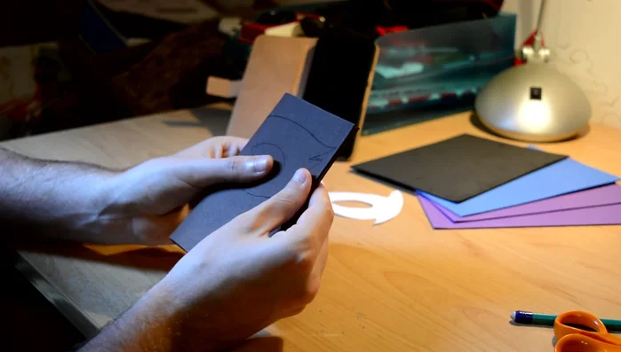 Transfer the design onto the foam sheet. Cut out the foam mask shape.