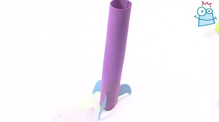 Attach the cone to the top of the rocket with glue.