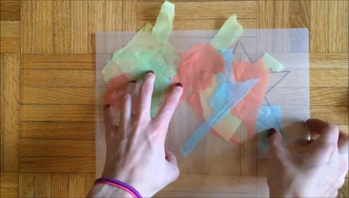 Carefully seal the laminating sheet (or apply contact paper/self-laminating sheets). If using a laminator, run the sheet through it. Adjust any tissue paper pieces that shift.