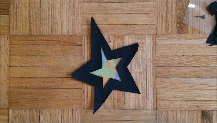 Punch a hole in your ornament, thread the string through, and tie it to create a hanger.