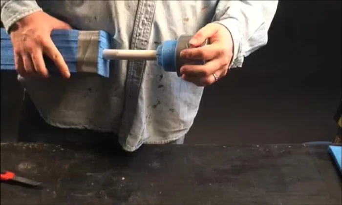 Cover the finished sword with duct tape, a sewn cloth cover (like a sock), or another preferred method. Secure with hockey tape.