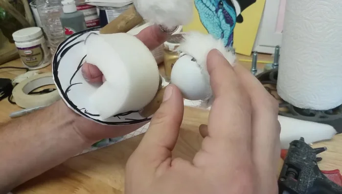 Create and attach a foam piece inside the mouth to secure fingers for eye operation.