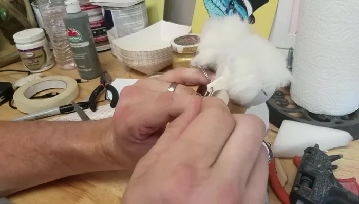 Create and attach a foam piece inside the mouth to secure fingers for eye operation.