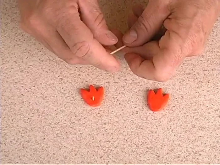 Attach the feet to the body using short pieces of toothpick.