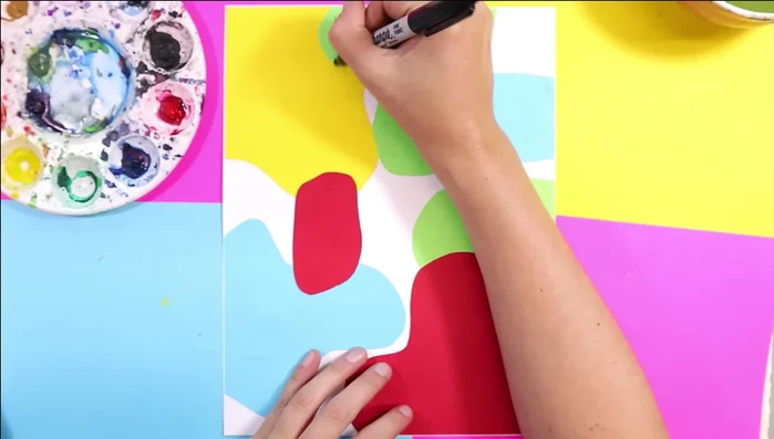 Enhance shapes with texture: Use a white pencil or oil pastel to add lines, zigzags, or swirls onto the colored shapes, adding further texture.