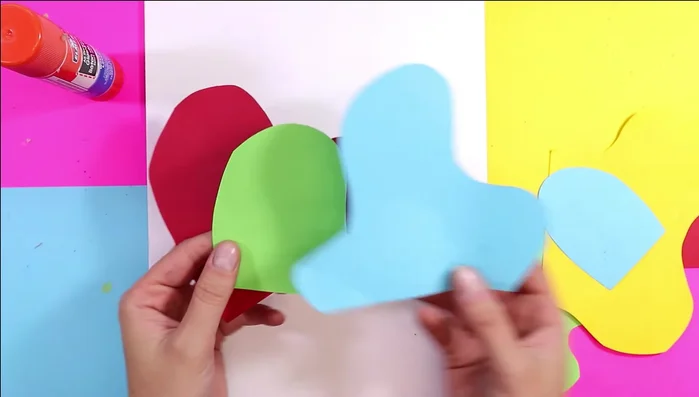 Enhance shapes with texture: Use a white pencil or oil pastel to add lines, zigzags, or swirls onto the colored shapes, adding further texture.