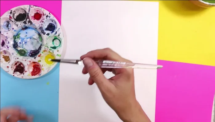 Paint rainbows: On a separate sheet of thick paper (cardstock or watercolor paper), paint 5-7 simplified rainbows using watercolor or other paints, leaving small gaps between colors to prevent blending.