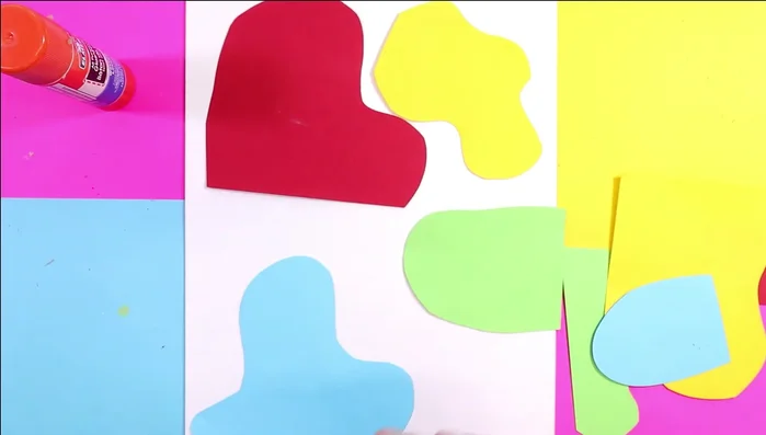 Enhance shapes with texture: Use a white pencil or oil pastel to add lines, zigzags, or swirls onto the colored shapes, adding further texture.