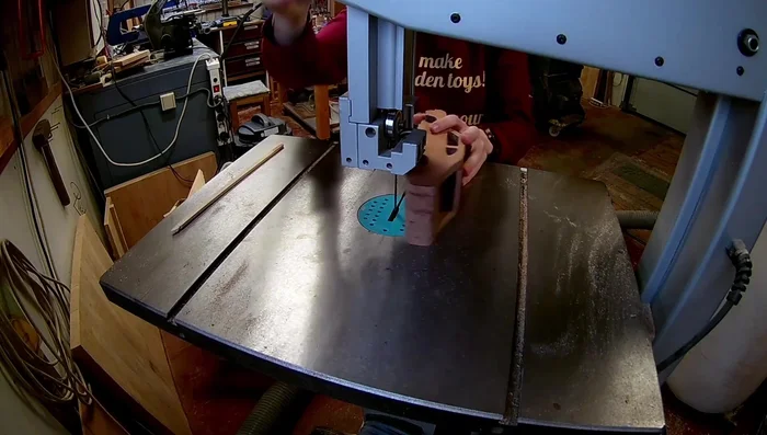 Perform final shaping using a belt sander and hand sanding.