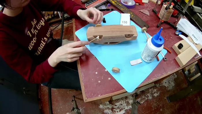 Glue in the wheels, cut off the axles, and finish with mineral oil.