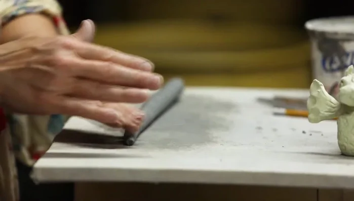 Taper one end of the coil to form the dragon's tail.