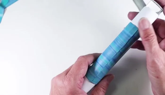 Shape the clay tube into desired form (e.g., marquee shape) before baking at the manufacturer's recommended temperature for one hour.