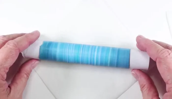 Shape the clay tube into desired form (e.g., marquee shape) before baking at the manufacturer's recommended temperature for one hour.