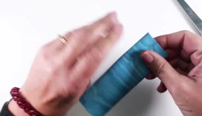 Cut the baked clay into strips using scissors or a rotary trimmer. Cut some strips in half to create shorter pieces for interior details.