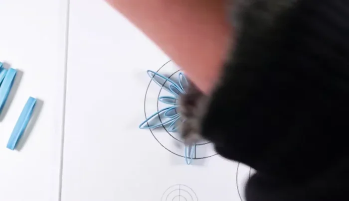 Cut and glue small v-shaped pieces to the ends of the interior loops, for further embellishment, optional.