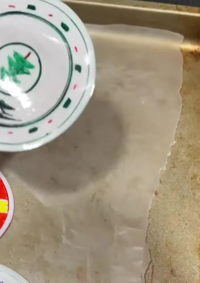 Punch a hole in the top of each flattened cup to add a tree hook or keychain ring.