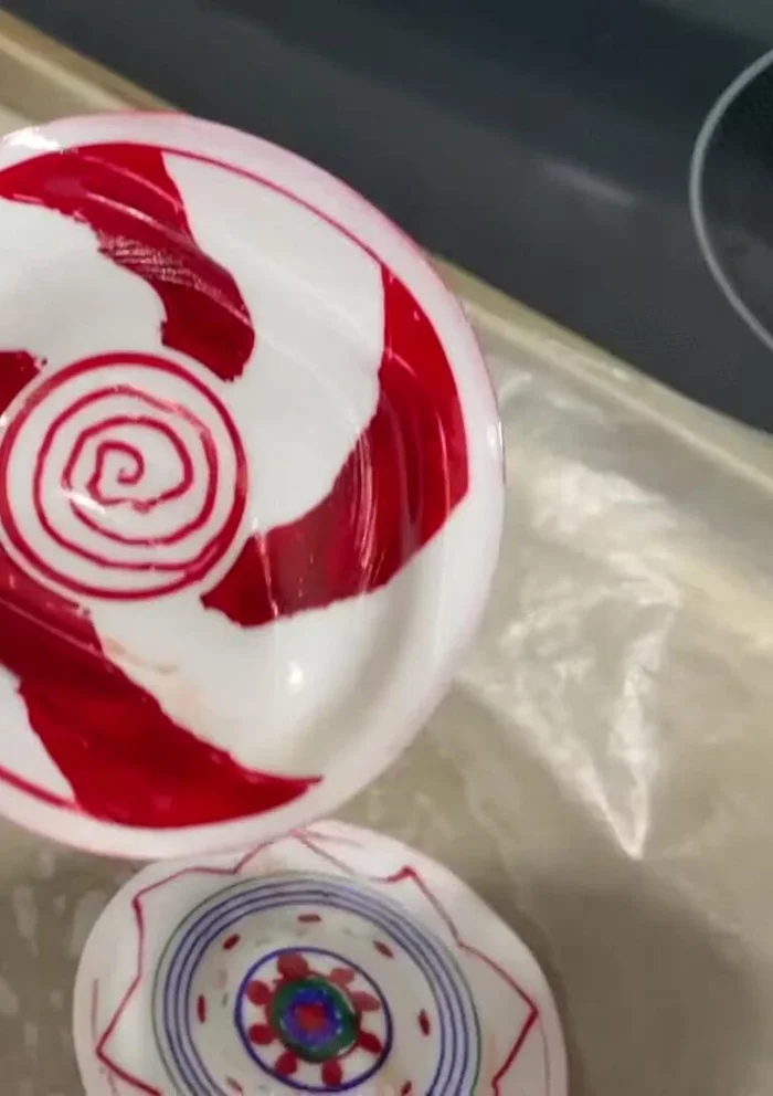 Punch a hole in the top of each flattened cup to add a tree hook or keychain ring.