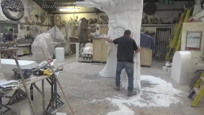 Applying a protective layer of sticky back tin foil to the polystyrene.