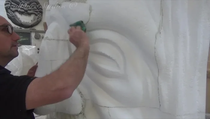 Applying a protective layer of sticky back tin foil to the polystyrene.