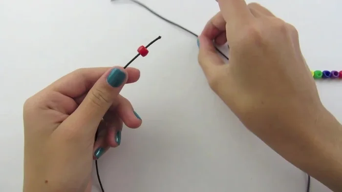 Pull both ends to center the bead.