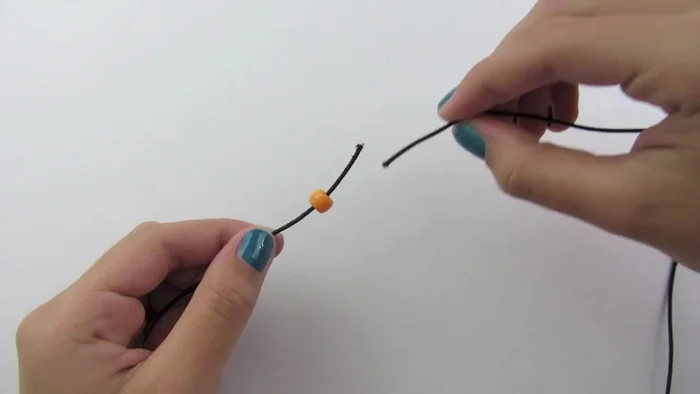 Repeat steps 2-4 with remaining beads until bracelet reaches desired wrist size.