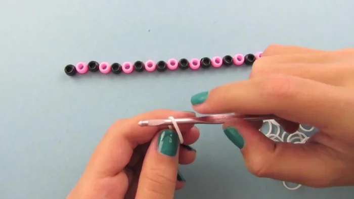 Remove one loop from the hook, leaving one loop on the hook and one on the C clip.