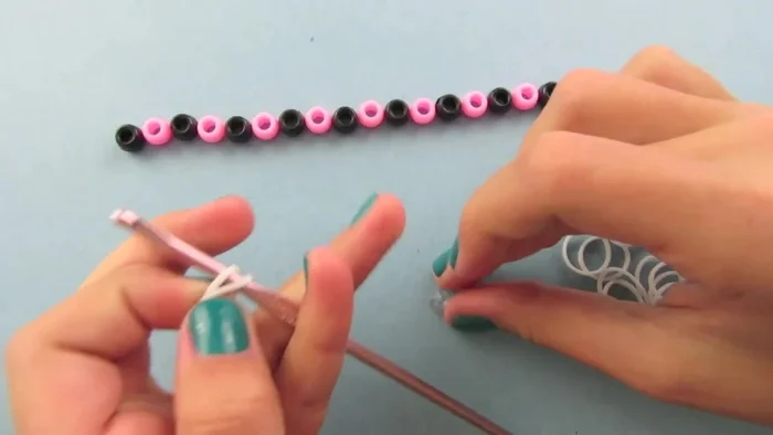 Remove one loop from the hook, leaving one loop on the hook and one on the C clip.