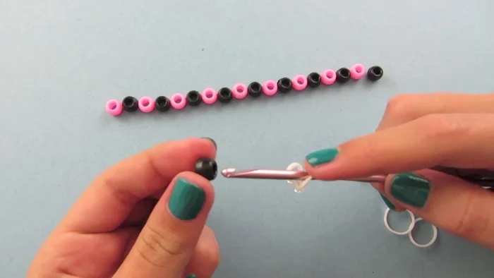 Place the other loop back onto the bead.